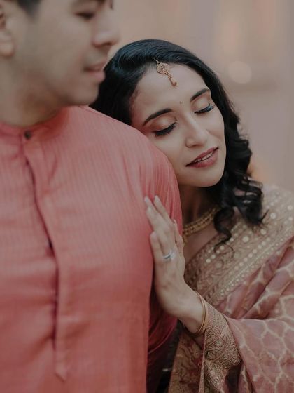 A close-up showing the soft, romantic makeup that enhances her features and creates a dreamy look.