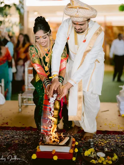 The Laja Homa, where the couple offers puffed rice to the sacred fire, symbolizing their joint commitment to a prosperous life together.