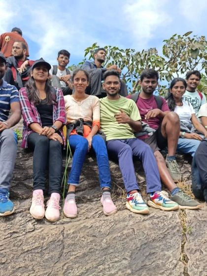 Taking a well-deserved rest on the rocks. Trekking is as much about pausing to appreciate the journey as it is about reaching the top.