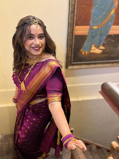 This flawless airbrush makeup look was created for Vishakha. The soft curls and traditional saree create a look that is both modern and classic.