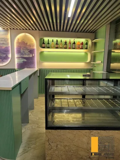 A close-up of the bar area at Rigo Restaurant, showing the custom shelving and display.
