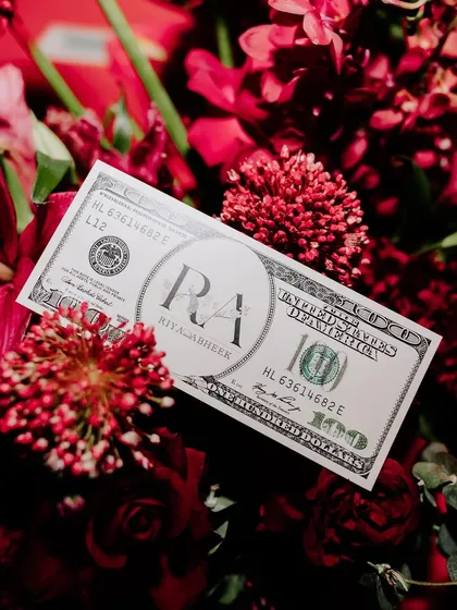 Custom-designed 'money' for a casino-themed party, featuring the couple's monogram. We love to carry a theme through to the smallest, most creative details.