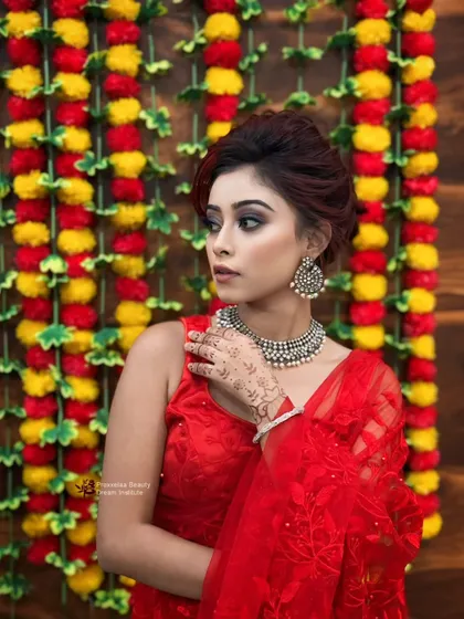 A touch of tradition, a dash of glamour. This look, with a smokey eye and silver jewelry against a red outfit, is perfect for a Diwali party or festive gathering.