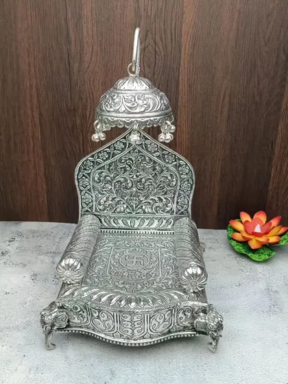 This is an antique mantap or singhasan for your god idols. Made from German silver, it provides a royal seat for your deities.