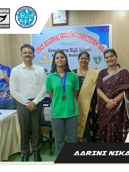 Aarini Nikam is recognized for her bronze medal at the CISCE Regional Shooting Competition. This photo with officials celebrates her entry into the competitive shooting circuit.
