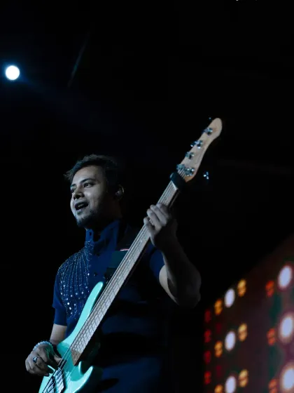 Our bassist enjoying the moment during our show in Singapore. We love to travel and bring our music to audiences around the world.