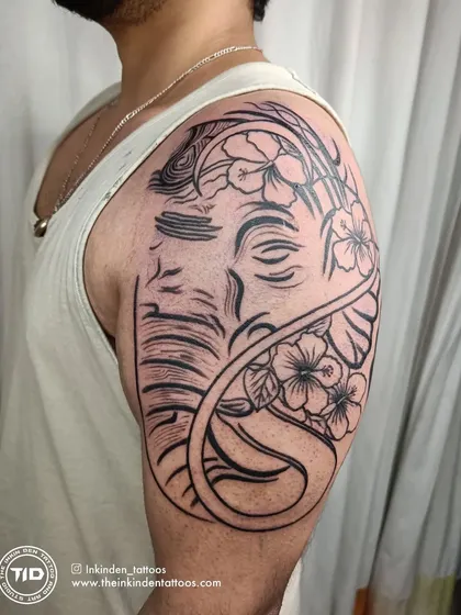 Another angle of the Ganesha line-work tattoo.