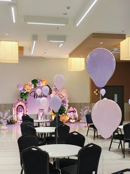 A view of the entire hall for the fairy-themed party, showing how we use floating balloons to extend the magical atmosphere throughout the space.
