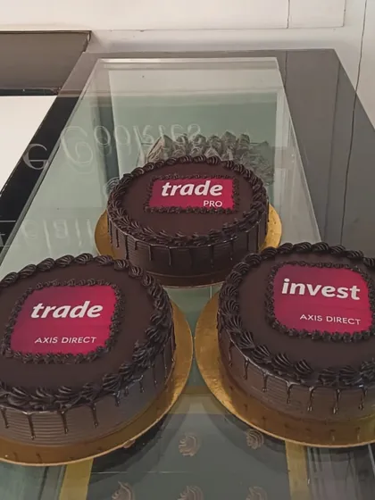 For large corporate events, I can create multiple cakes with consistent branding. This order for Axis Direct features their different service logos on rich chocolate cakes, perfect for a multi-team celebration or brand activation.