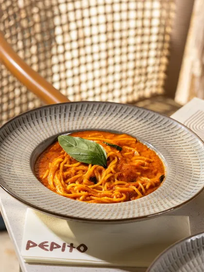 A classic spaghetti pomodoro, simple, elegant, and beautifully lit.