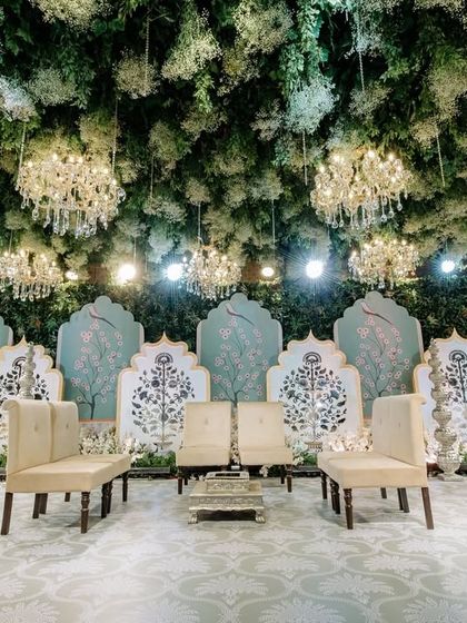 With lush greenery, cascading florals, and twinkling lights, my enchanted forest decor transforms this wedding into a magical wonderland. This stage design is where fairytales meet reality.