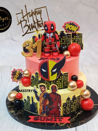 An epic two-tier Deadpool and Wolverine themed cake for a 31st birthday. This 2kg choco-butterscotch cake is perfect for a fan, featuring bold colors and comic book action.