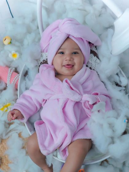 A top-down view of the baby spa theme, showing the baby's happy, relaxed expression.