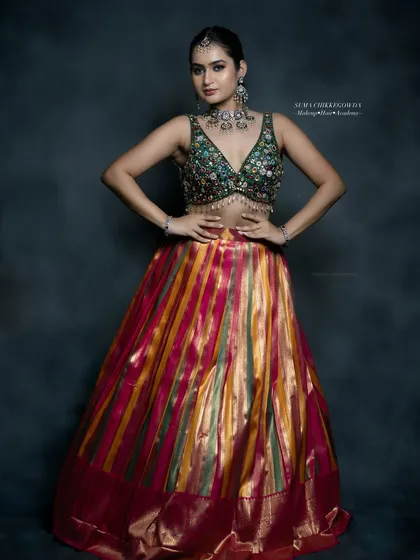 Perfect for a Sangeet or Mehendi, this look features a vibrant lehenga with modern, glamorous makeup. I used a subtle smokey eye and a neutral lip to balance the colorful outfit, creating a look that's both festive and chic.