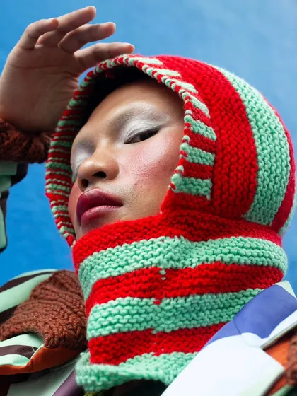 The sky's the limit. This portrait from the "Kaleidoscope" series uses the open sky as a backdrop, emphasizing the model's expression and the unique, colorful headpiece.