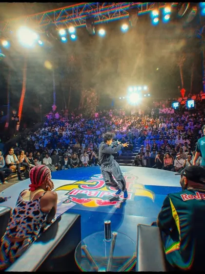 Event coverage is about capturing the atmosphere. Here, I framed the shot to show not just the performer but the massive, engaged crowd and the scale of the Red Bull BC One production.