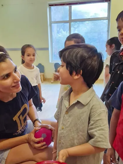 Guiding a young student through an exercise. We provide individual attention to ensure every child feels seen, heard, and supported.
