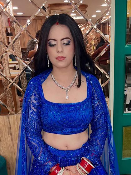 A close-up of the makeup for the royal blue lehenga look. The sharp eyeliner and perfectly blended eyeshadow make her eyes the star of the show.