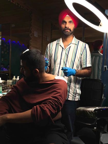 Another shot from the neck tattoo session, showing the studio setup.