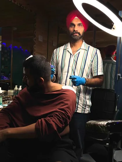 Another shot from the neck tattoo session, showing the studio setup.