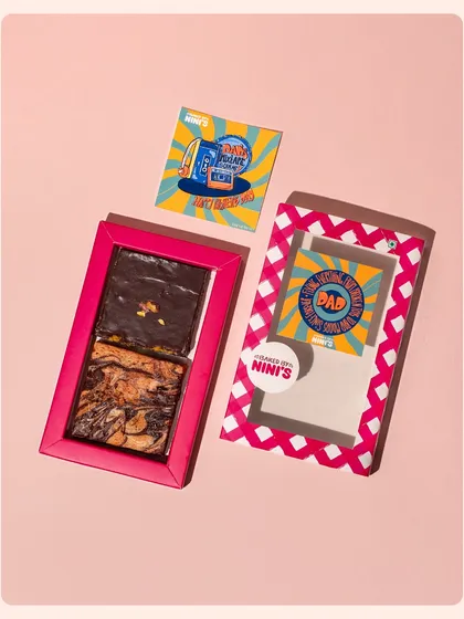A brownie gift box for Father's Day, showcasing the packaging and the product. The angled composition adds a dynamic feel to this e-commerce style shot.