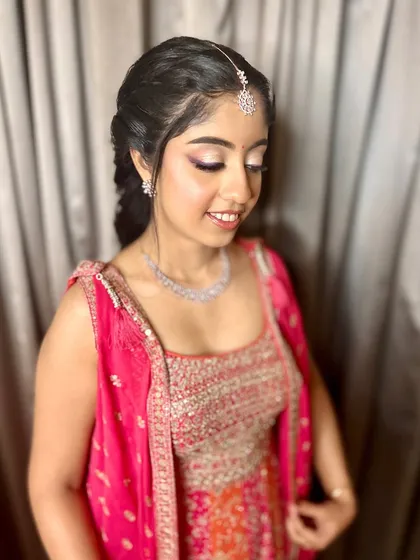 Simplicity and glam combined. I loved crafting this minimal yet captivating look with a pop of color and an intricate floral braid for a festive event.
