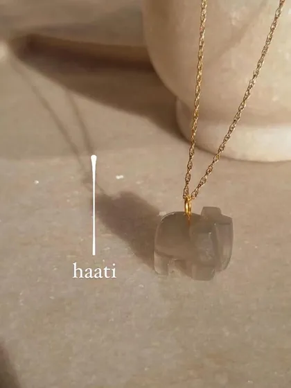 My 'haati' elephant pendant, carved from grey moonstone. This stone is for new beginnings, inner growth, and soothing emotional stress.