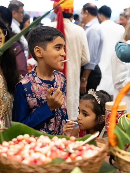 The pure joy of a child enjoying a treat at our "Back to School" counter. These are the small, precious moments that make every event special.