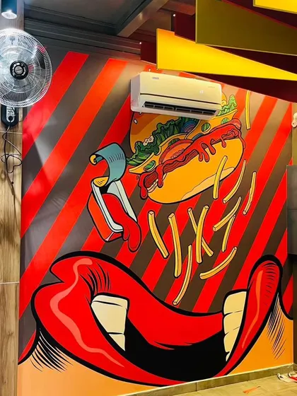 This fun and energetic pop-art mural is perfect for a fast-food restaurant or cafe. The bold colors and graphic design create a playful atmosphere that matches the brand's identity.