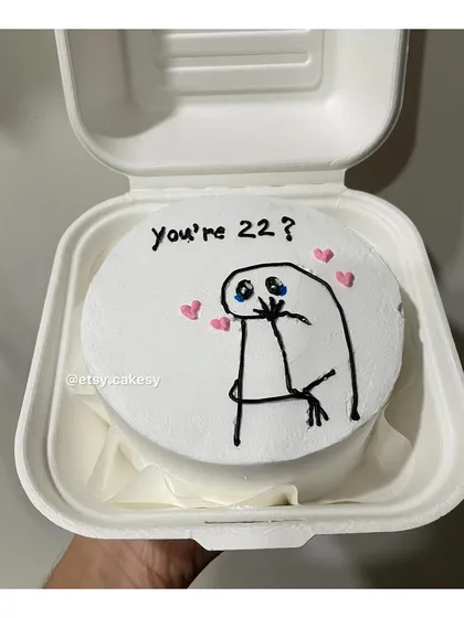 A cute meme-themed bento cake with a shy character and the text 'you're 22?'. Perfect for a fun birthday surprise.