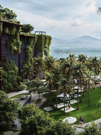 A view from the Westin Nashik, looking out over the lush landscape and water. The architecture is designed to frame these stunning views, enhancing the guest experience.
