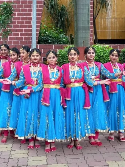 A group photo of another talented dance troupe dressed in my blue and pink classical costumes. These anarkali-style outfits are perfect for performances, providing both elegance and ease of movement.