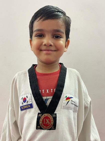 Another one of our champions. His happy face and medal are a testament to the positive and successful environment we foster.