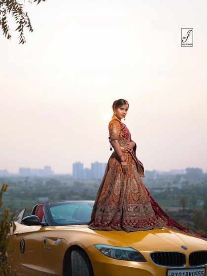 A profile shot that captures the model looking back, showcasing the details of her hair, makeup, and the side profile of the outfit.