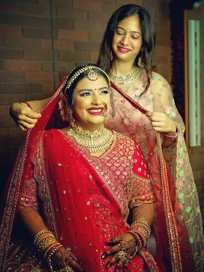 It's the unscripted moments that tell the real story. This candid shot from a getting ready session captures a genuine smile as the bride's veil is adjusted, a beautiful memory before the main event.