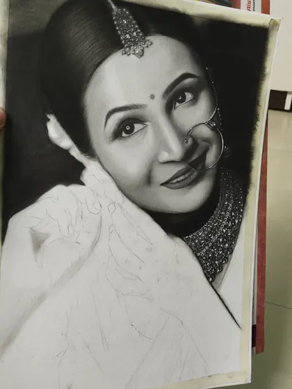 The bride's portrait is almost finished in this shot. I've completed the shading on her face and jewelry and am now working on the final details of her clothing.