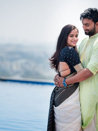 A romantic portrait of a couple by the pool, perfectly capturing a moment of love and connection for their Valentine's or anniversary shoot.