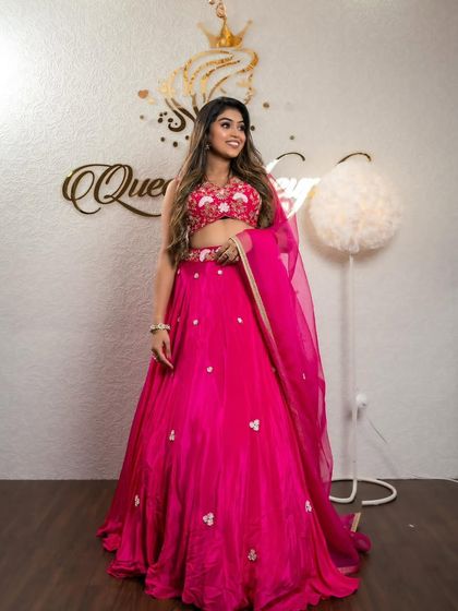 A full view of the client in the bright pink lehenga, perfect for a fun and vibrant event.