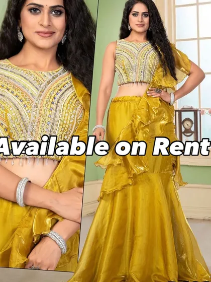This bright yellow ruffled lehenga-saree is a fun and festive option for a Mehendi or Sangeet. The pre-draped style is easy to wear, and the embroidered crop top adds the perfect amount of sparkle. Rent this outfit for a picture-perfect celebration.