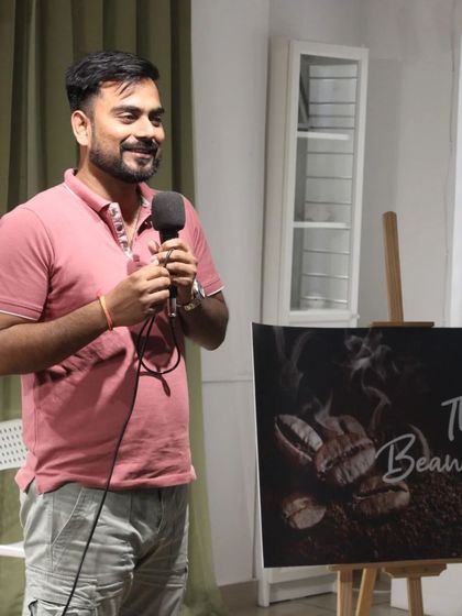 A performer shares a story with a smile. The atmosphere at our events is always welcoming and encouraging for new and seasoned artists alike.