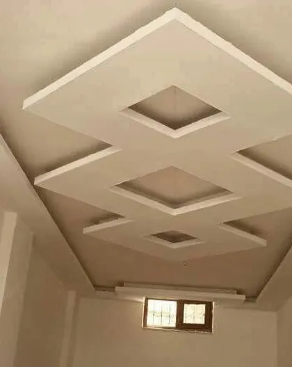 A multi-level geometric design in a raw, unpainted state. This type of design adds a lot of architectural interest to a simple room.