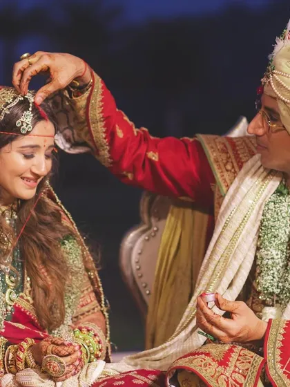 The groom applies sindoor, a deeply significant and emotional moment that we ensure is captured beautifully.