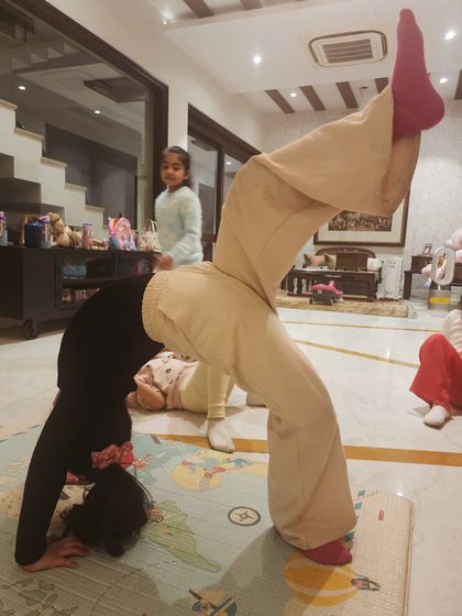 Our little movers warming up for the moves ahead. This partner stretch is a fun way to work on flexibility and build trust.