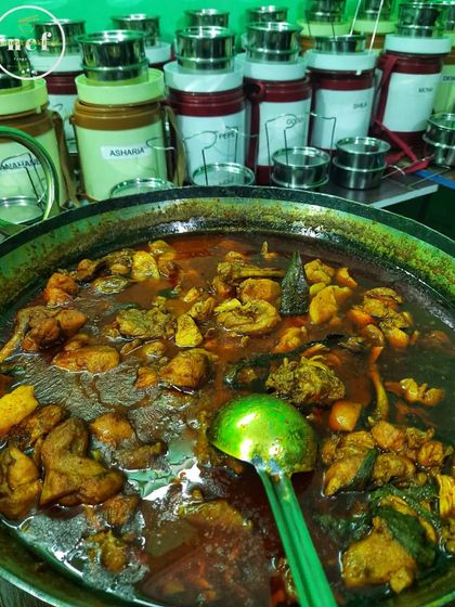 A large pot of chicken curry simmering away, ready to be served to my customers.