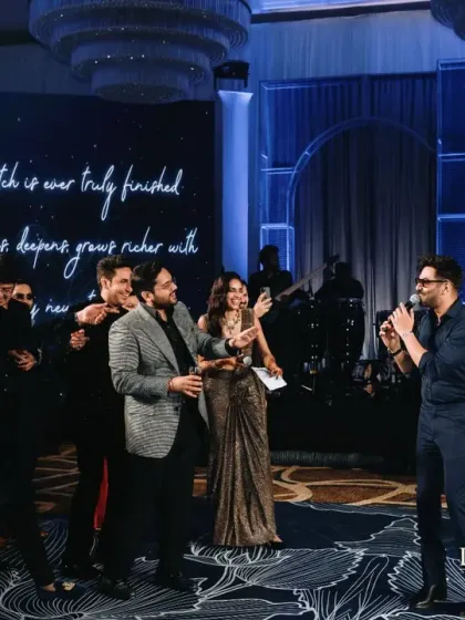 A candid moment of laughter and fun on the reception stage. My goal is to create a relaxed and joyful atmosphere where families and friends can create lasting memories together.