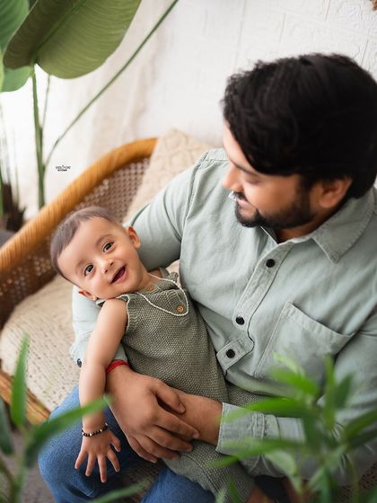 A happy baby boy enjoying some quality time with his dad.