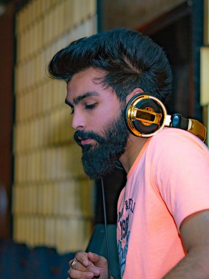 A close-up shot of me with my gold headphones, focused on the music.