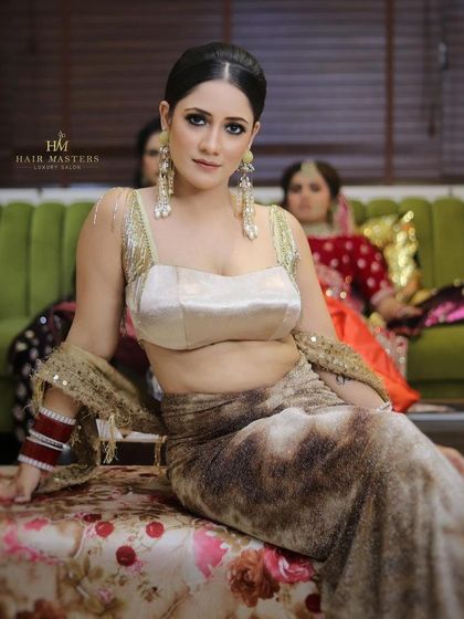 A confident portrait of the client in her unique velvet and satin outfit, ready for the party.