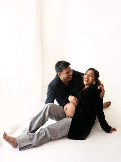 Capturing the fun and laughter between a couple is the best. These candid moments during a casual maternity shoot are pure gold.
