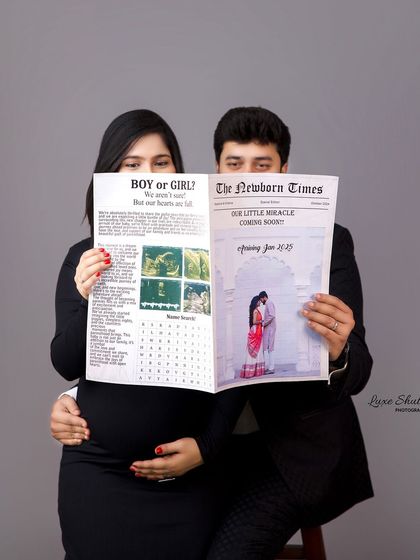A fun and creative announcement shot with the couple holding a custom "Newborn Times" newspaper. It's a unique and memorable way to share their news.